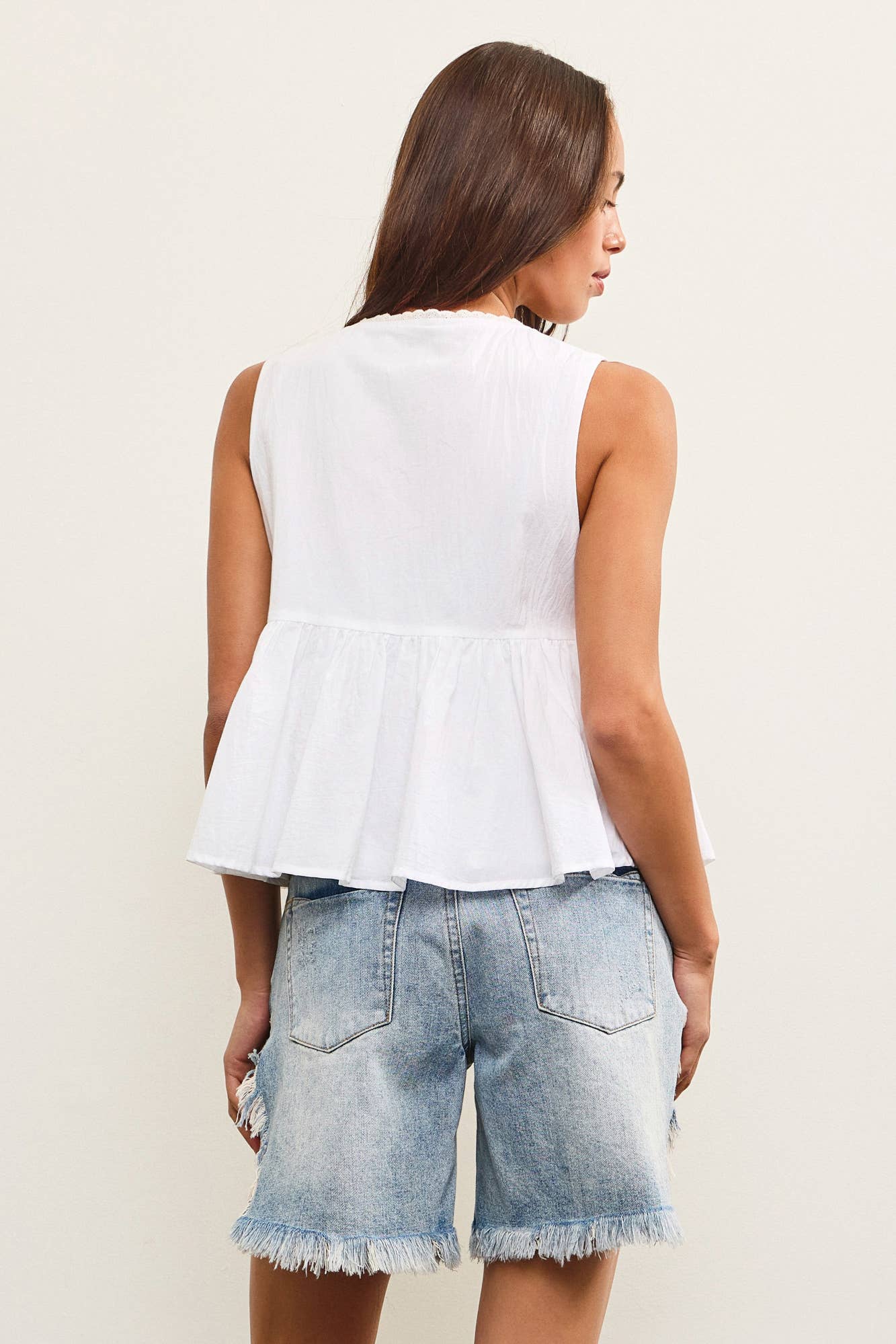 TIE FRONT SLEEVELESS PEPLUM TOP
