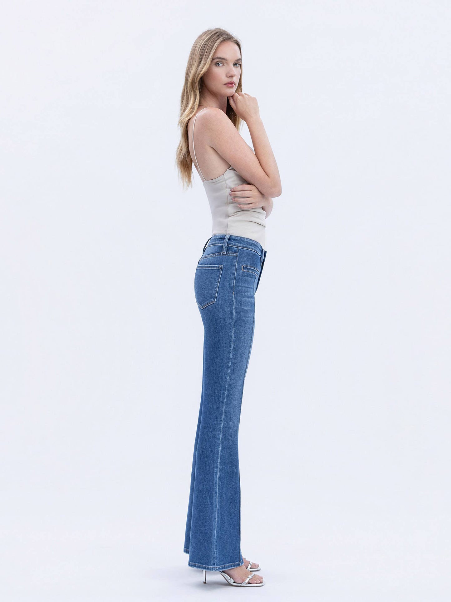 MID RISE WELT POCKET PIN TUCK FLARE JEANS