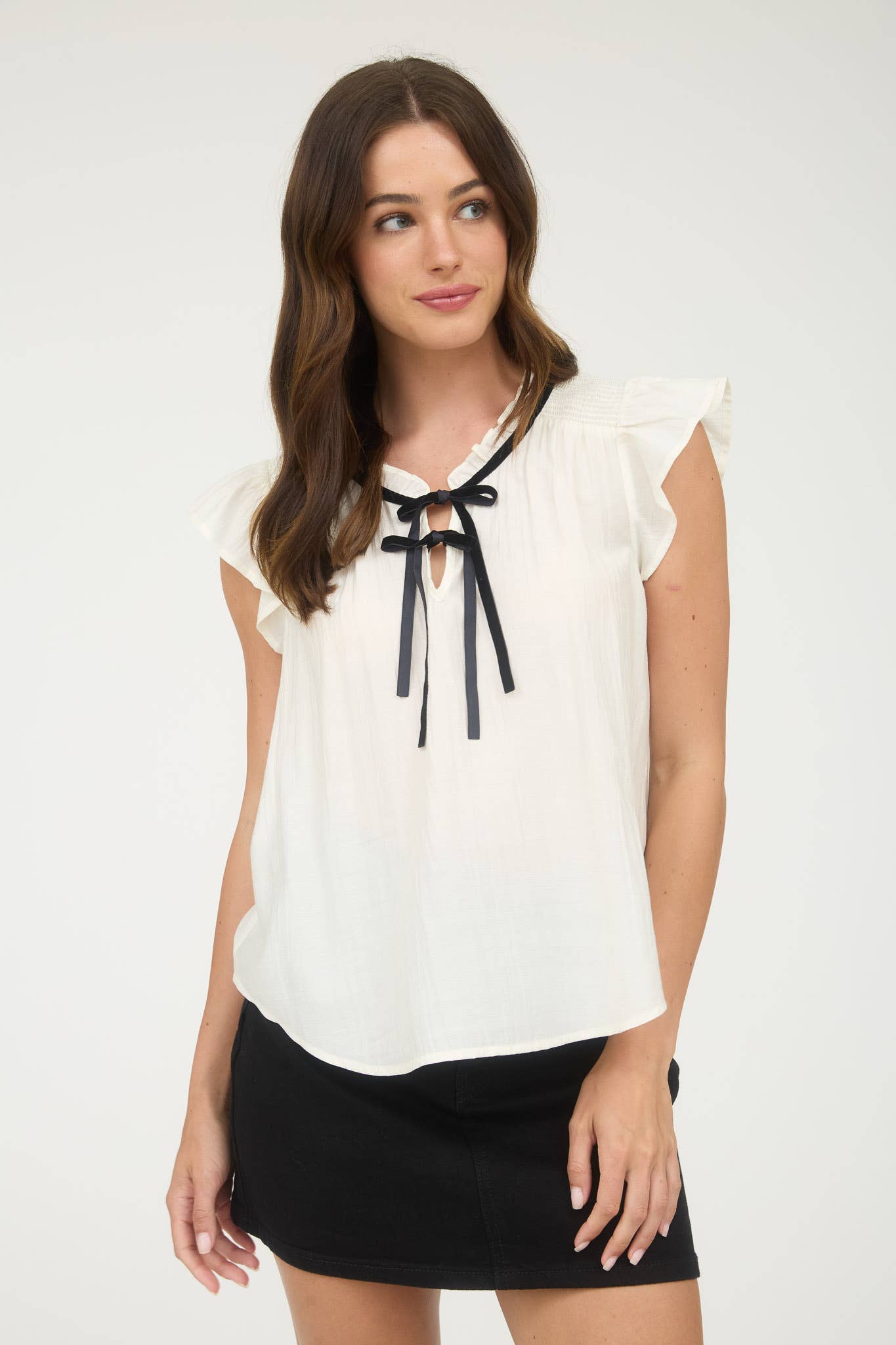 Ruffled blouse with front bow tie