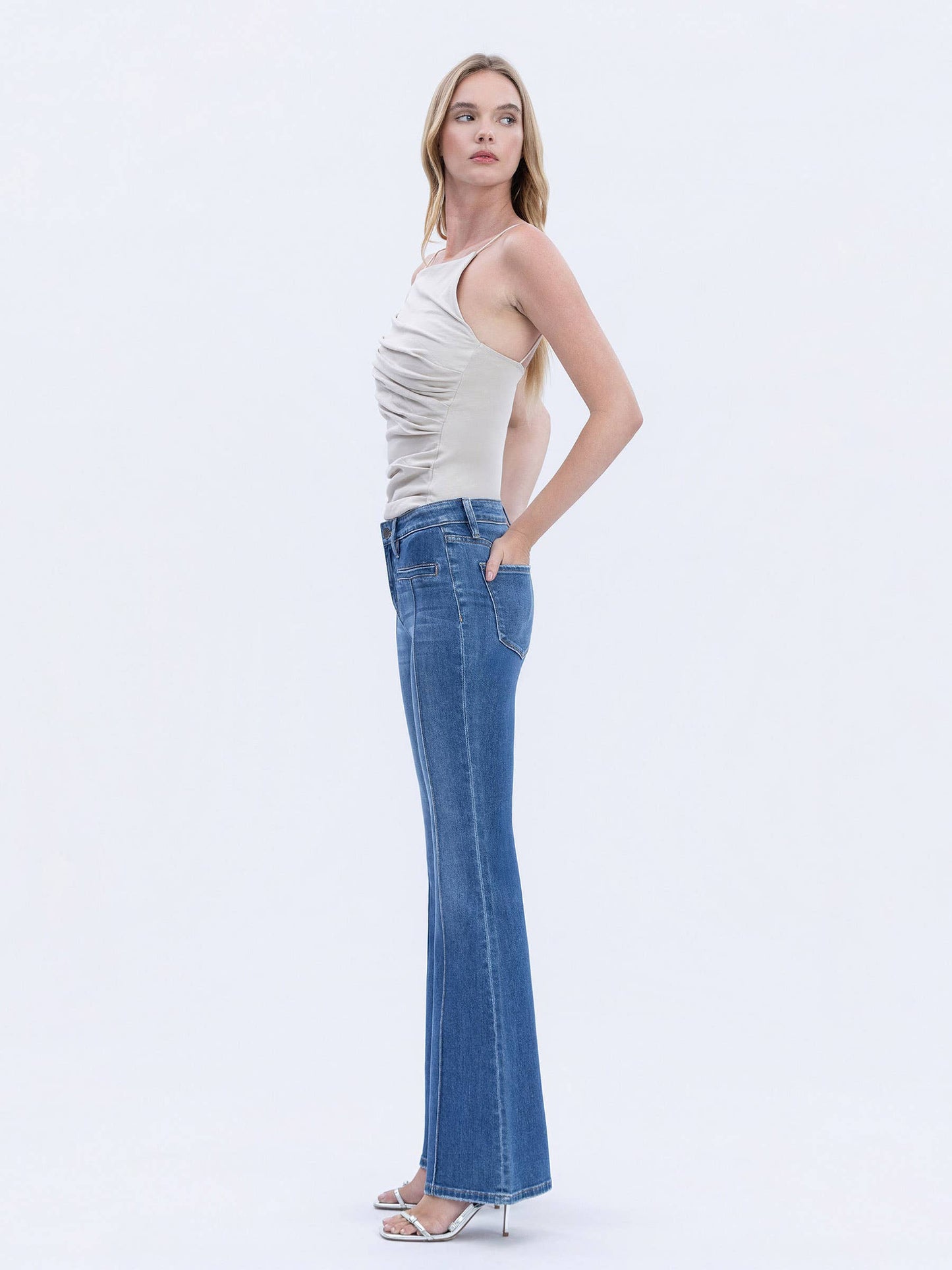 MID RISE WELT POCKET PIN TUCK FLARE JEANS