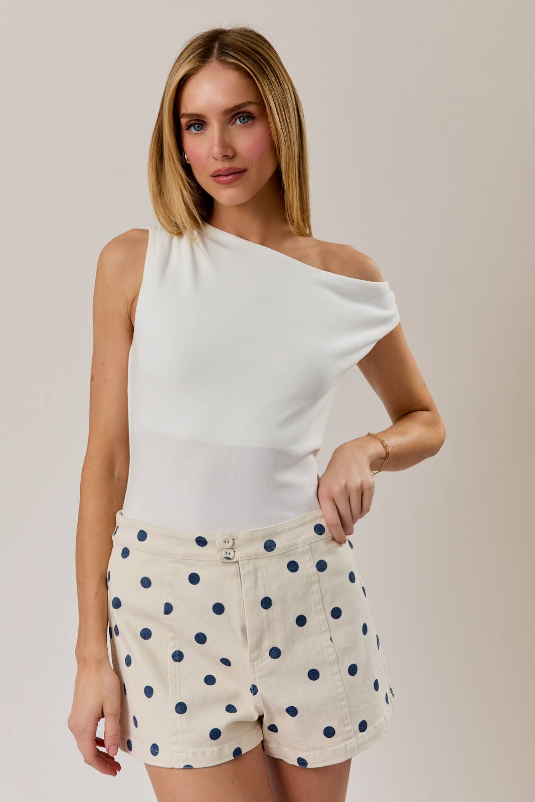ASYMMERTRICAL NECK SLEEVELESS KNIT TOP